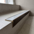 Solid brass stair nosing, 59.5mm tread with a 30mm raked-back front, in Antique Bronze finish, fitted to a staircase