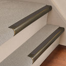 Antique Brass finish with Granite Castellated insert - 63.5mm solid brass bullnose stair nosing fitted to a carpeted step