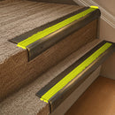 Solid brass 63.5mm bullnose stair nosing fitted to a step - Antique Brass with Yellow Castellated insert