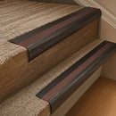 Solid brass 63.5mm bullnose stair nosing fitted to a step - Antique Bronze with Claret Castellated insert