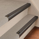 Antique Bronze finish with Granite Castellated insert - 63.5mm solid brass bullnose stair nosing fitted to a carpeted step