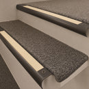 Antique Bronze finish with Ivory Castellated insert - 63.5mm solid brass bullnose stair nosing fitted to a carpeted step