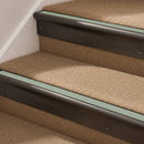 Antique Bronze finish with Jade Castellated insert - 63.5mm solid brass bullnose stair nosing fitted to a carpeted step