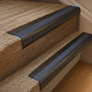 Solid brass 63.5mm bullnose stair nosing fitted to a step - Antique Bronze with Regency Castellated insert