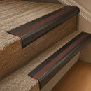 Solid brass 63.5mm bullnose stair nosing fitted to a step - Antique Bronze with Rustic Castellated insert