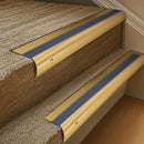 Solid brass 63.5mm bullnose stair nosing fitted to a step - Polished Brass with Regency Castellated insert