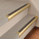 Satin Brass finish with Granite Castellated insert - 63.5mm solid brass bullnose stair nosing fitted to a carpeted step