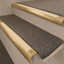 Satin Brass finish with Ivory Castellated insert - 63.5mm solid brass bullnose stair nosing fitted to a carpeted step