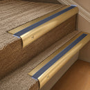 Solid brass 63.5mm bullnose stair nosing fitted to a step - Satin Brass with Regency Castellated insert