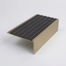 Solid brass 59mm slimline stair nosing with black castellated anti-slip insert, studio view of the profile
