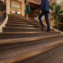 Bronze finish self-adhesive aluminium stair nosing 30mm x 20mm fitted to a step edge