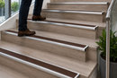 Semi-rounded bullnose stair nosing with brown anti-slip insert