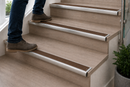 Brown anti-slip insert on a semi-rounded bullnose stair nosing