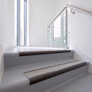 Bullnose DDA aluminium stair nosing 70 x 56mm in Dark Bronze with Everest Exterior Grip insert, fitted to grey vinyl stairs in an office stairwell