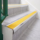 Bright Polished 70 x 37mm bullnose stair nosing, Solar High Grip insert, on vinyl school stairs