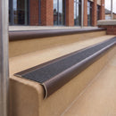 Dark Bronze 70 x 37mm bullnose stair nosing, Coal Exterior Grip insert, on outdoor entrance steps