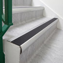 Mill Finish 70 x 37mm bullnose stair nosing, Obsidian High Grip insert, on vinyl school stairs