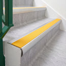 Mill Finish 70 x 37mm bullnose stair nosing, Solar High Grip insert, on vinyl school stairs