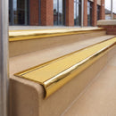 Mirrorflect Gold 70 x 37mm bullnose stair nosing, Brimstone Exterior Grip insert, on outdoor entrance steps