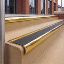 Mirrorflect Gold 70 x 37mm bullnose stair nosing, Coal Exterior Grip insert, on outdoor entrance steps