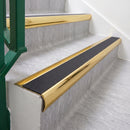Mirrorflect Gold 70 x 37mm bullnose stair nosing, Obsidian High Grip insert, on vinyl school stairs