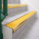 Mirrorflect Gold 70 x 37mm bullnose stair nosing, Solar High Grip insert, on vinyl school stairs