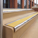 Mirrorflect Silver 70 x 37mm bullnose stair nosing, Brimstone Exterior Grip insert, on outdoor entrance steps