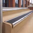 Mirrorflect Silver 70 x 37mm bullnose stair nosing, Coal Exterior Grip insert, on outdoor entrance steps