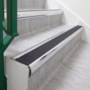 Mirrorflect Silver 70 x 37mm bullnose stair nosing, Obsidian High Grip insert, on vinyl school stairs