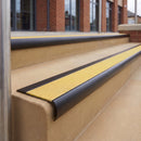 Satin Black 70 x 37mm bullnose stair nosing, Brimstone Exterior Grip insert, on outdoor entrance steps