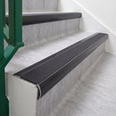 Satin Black 70 x 37mm bullnose stair nosing, Obsidian High Grip insert, on vinyl school stairs
