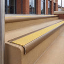 Satin Bronze 70 x 37mm bullnose stair nosing, Brimstone Exterior Grip insert, on outdoor entrance steps