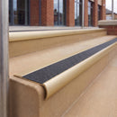 Satin Gold 70 x 37mm bullnose stair nosing, Coal Exterior Grip insert, on outdoor entrance steps