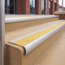 Satin Silver 70 x 37mm bullnose stair nosing, Brimstone Exterior Grip insert, on outdoor entrance steps