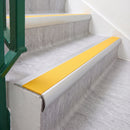 Satin Silver 70 x 37mm bullnose stair nosing, Solar High Grip insert, on vinyl school stairs