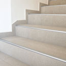 Aluminium Tile-In Bullnose Stair Nosing for 10mm & 12mm Tiles, 2.6m Matt Silver fitted on a tiled staircase