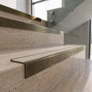 Antique Brass carborundum insert stair nosing with chalk CarbiGrip insert fitted to travertine steps