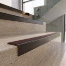 Antique Bronze carborundum insert stair nosing with chestnut CarbiGrip insert fitted to travertine steps