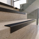 Antique Bronze carborundum insert stair nosing with obsidian CarbiGrip insert fitted to travertine steps
