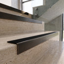 Antique Bronze carborundum insert stair nosing with black ridged PVC insert fitted to travertine steps