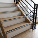 Champagne anodised aluminium stair nosing with rubber inserts fitted full width on LVT communal stairs