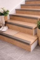 Champagne anodised self-adhesive stair nosing 25x20mm fitted on oak stairs