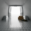 Aluminium chequer plate flooring lining the load area of a UK van