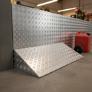 Aluminium chequer plate fitted as a step and ramp edge in a UK workshop