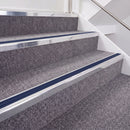 Bright Polished double insert chevron stair nosing, 40mm riser with Dark Blue inserts, fitted on carpeted stairs