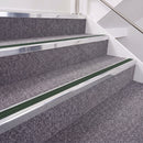 Bright Polished double insert chevron stair nosing, 40mm riser with Dark Green inserts, fitted on carpeted stairs
