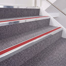 Bright Polished double insert chevron stair nosing, 40mm riser with Red inserts, fitted on carpeted stairs
