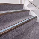 Dark Bronze double insert chevron stair nosing, 40mm riser with Aura inserts, fitted on carpeted stairs