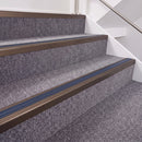 Dark Bronze double insert chevron stair nosing, 40mm riser with Blue inserts, fitted on carpeted stairs