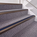 Dark Bronze double insert chevron stair nosing, 40mm riser with Dark Blue inserts, fitted on carpeted stairs